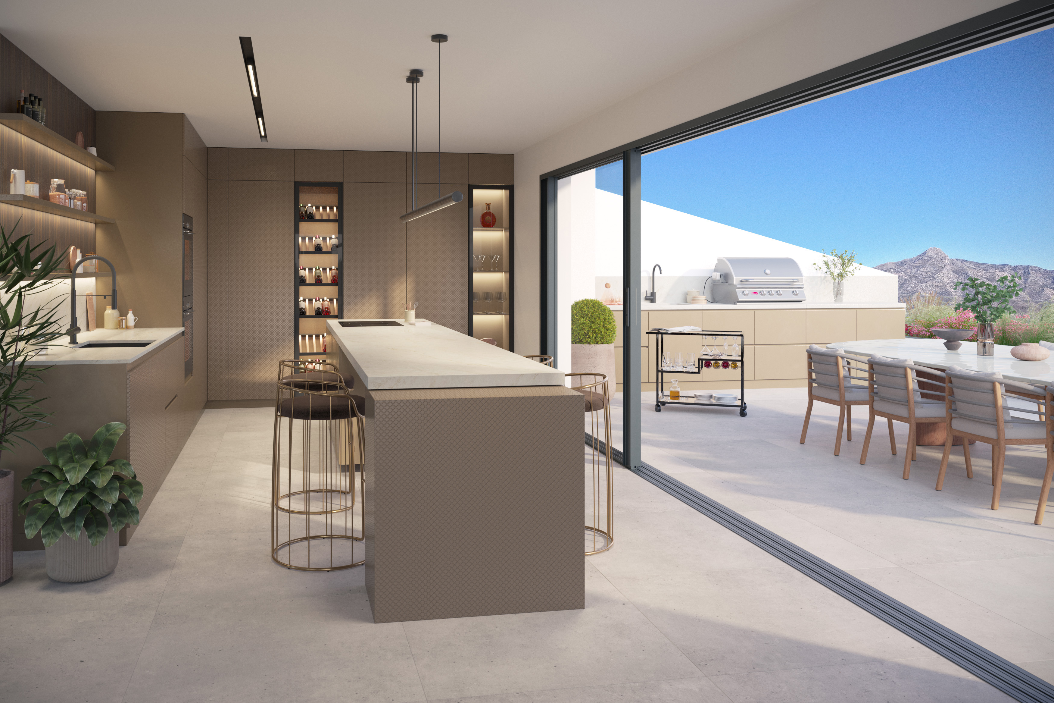 Island kitchen opening onto a terrace in a Marbella West residence
